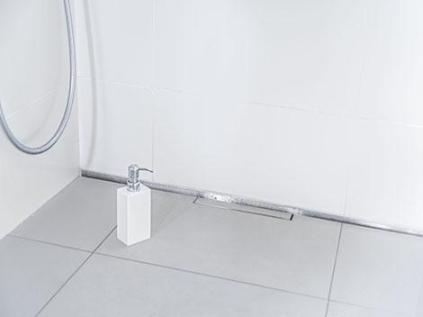 The CeraWall Individual shower channel helped make the new bathroom barrier-free and accessible to wheelchair users